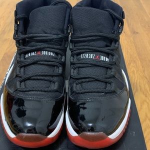 Jordan 11s black and red